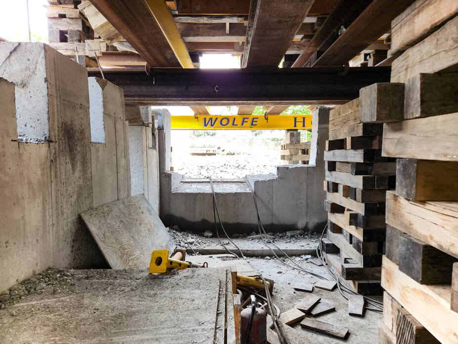 Basement view of cribbing and lifting steel under Guy Park Manor