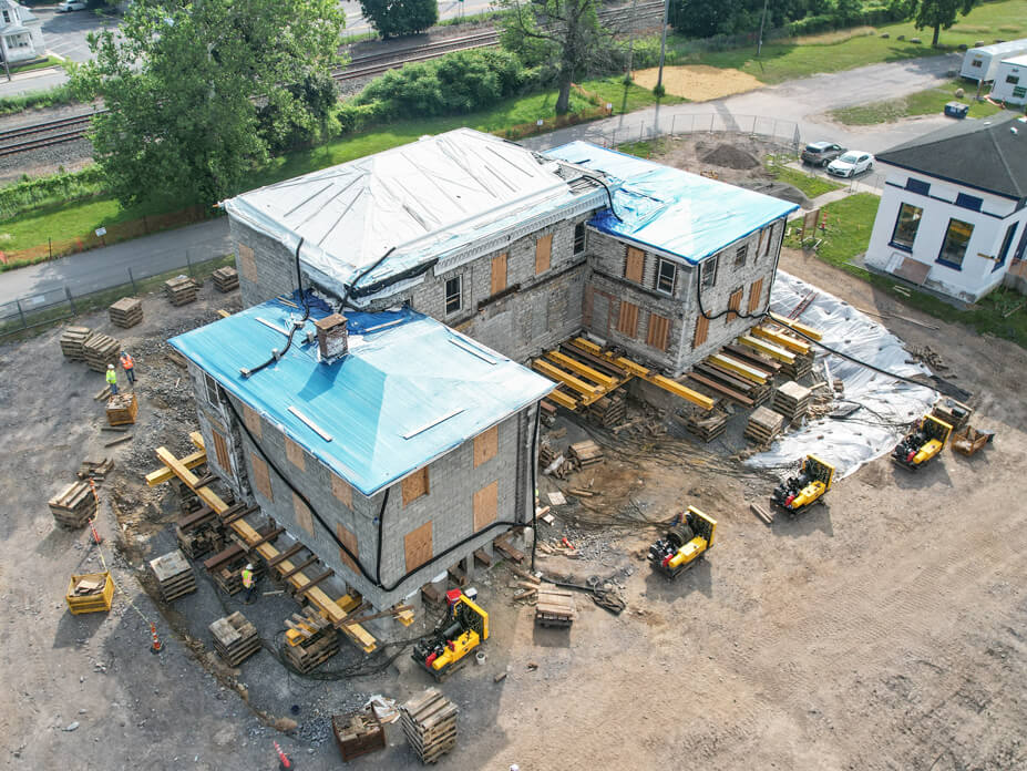 Aerial view of Guy Park Manor with unified jacking machines in foreground