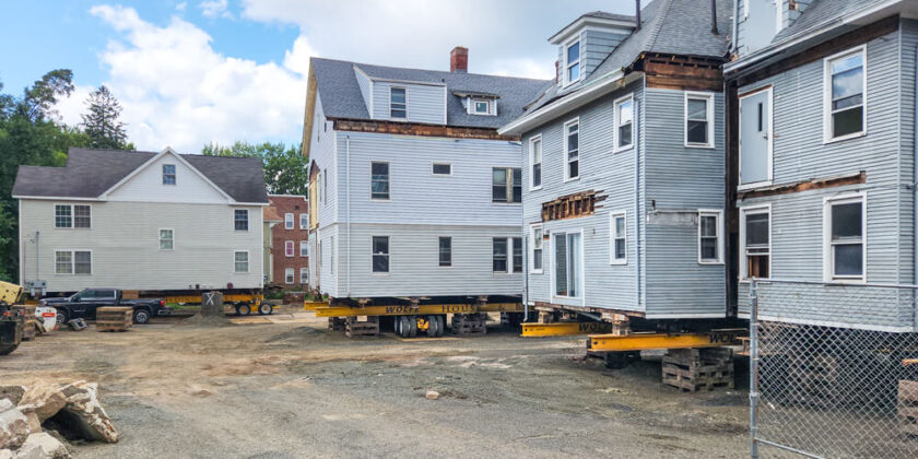 Several houses sit on dollies and cribbing in Hartford, CT, as Wolfe prepares to relocate them.