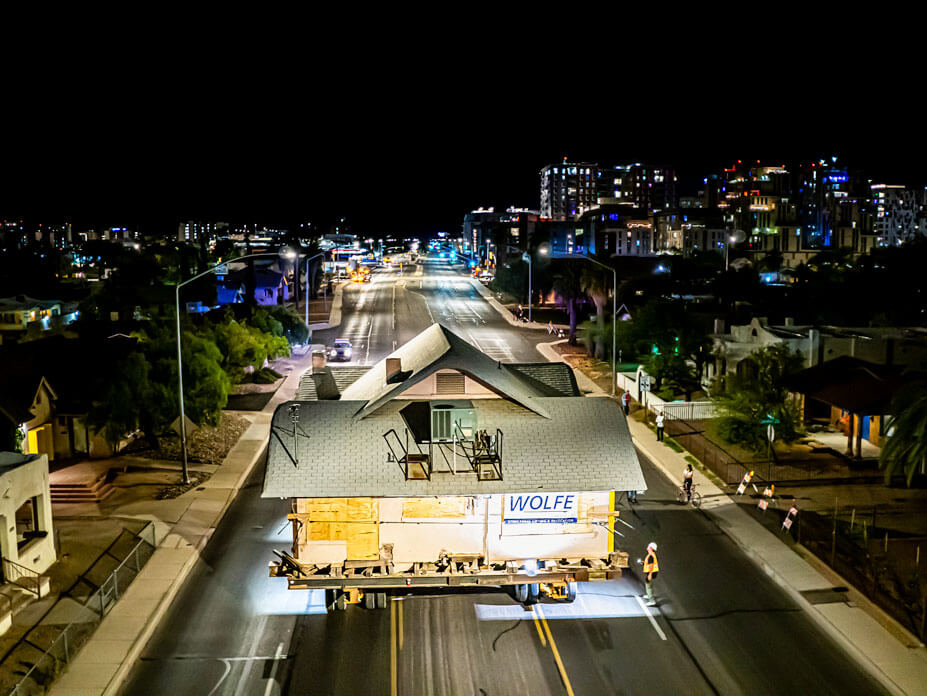 Aerial view of Wolfe driving a house down a street in Tucson, Arizona